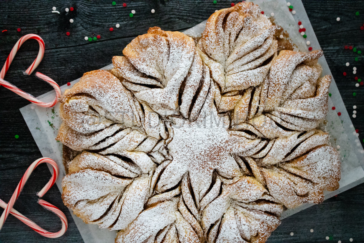 Semi-Exclusive Cinnamon Roll Snowflake on Weathered Wood