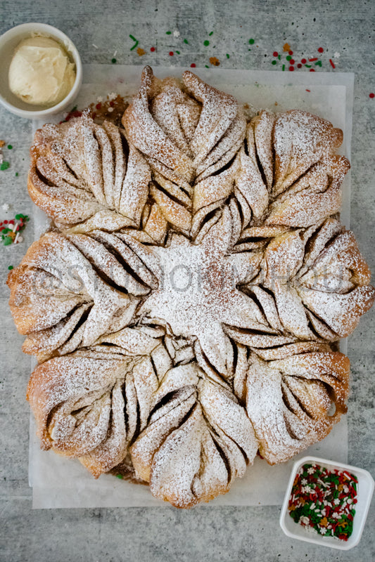 Semi-Exclusive Cinnamon Roll Snowflake on Concrete