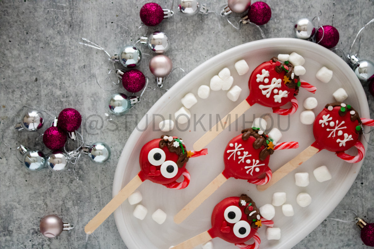 Semi-Exclusive Hot Cocoa Oreo Pop on Concrete