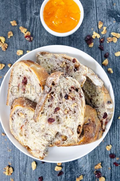 Semi-Exclusive Orange Cranberry Walnut Sourdough on Weathered Wood