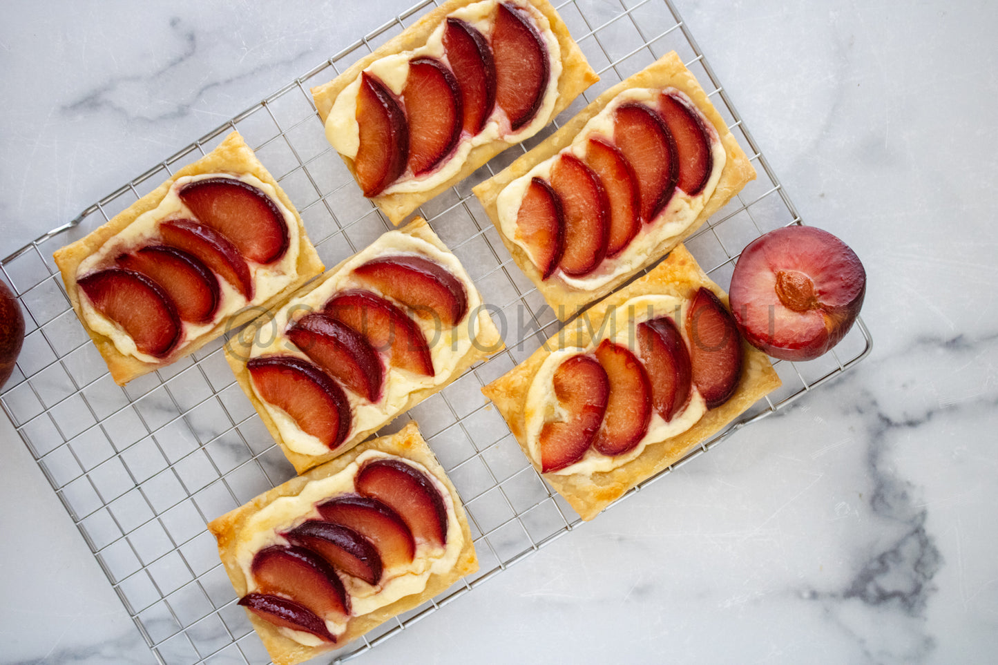 Semi-Exclusive Plum Puff Pastry Tart on Marble