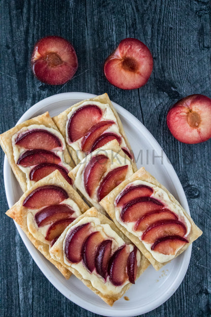 Semi-Exclusive Plum Puff Pastry Tart on Weathered Wood