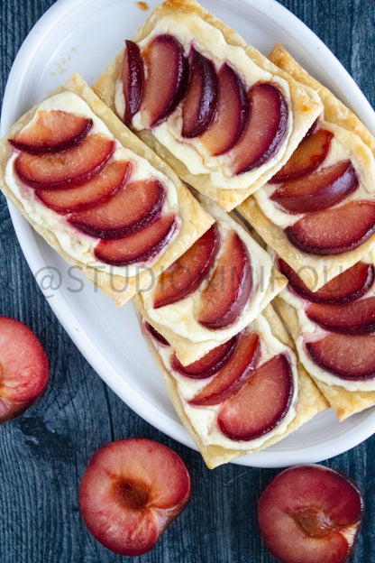 Semi-Exclusive Plum Puff Pastry Tart on Weathered Wood