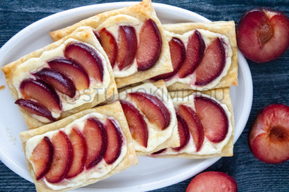Semi-Exclusive Plum Puff Pastry Tart on Weathered Wood