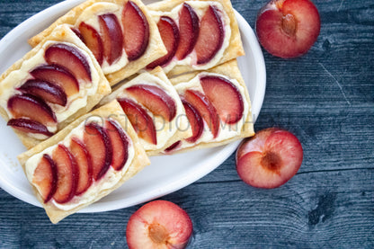 Semi-Exclusive Plum Puff Pastry Tart on Weathered Wood
