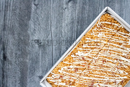 Semi-Exclusive Sweet Potato Rice Krispy Treats on Weathered Wood