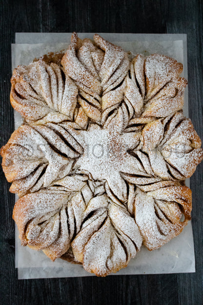 Semi-Exclusive Cinnamon Roll Snowflake on Weathered Wood