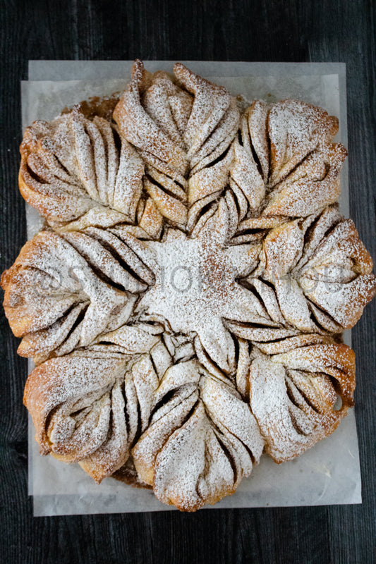 Semi-Exclusive Cinnamon Roll Snowflake on Weathered Wood