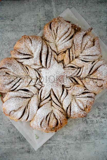 Semi-Exclusive Cinnamon Roll Snowflake on Concrete