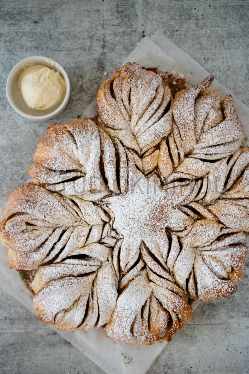 Semi-Exclusive Cinnamon Roll Snowflake on Concrete