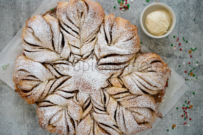 Semi-Exclusive Cinnamon Roll Snowflake on Concrete