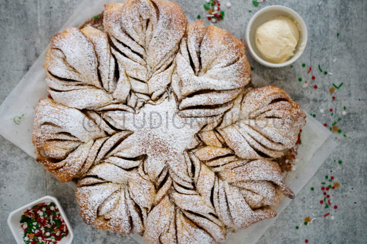 Semi-Exclusive Cinnamon Roll Snowflake on Concrete