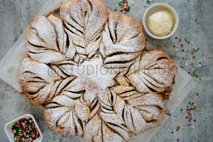 Semi-Exclusive Cinnamon Roll Snowflake on Concrete
