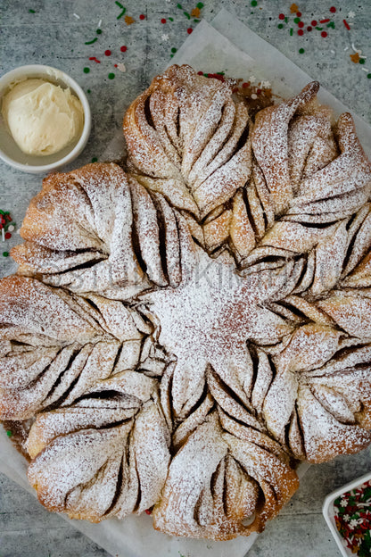 Semi-Exclusive Cinnamon Roll Snowflake on Concrete