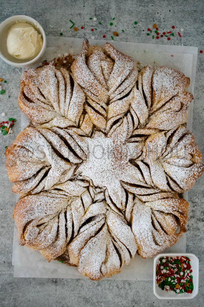 Semi-Exclusive Cinnamon Roll Snowflake on Concrete