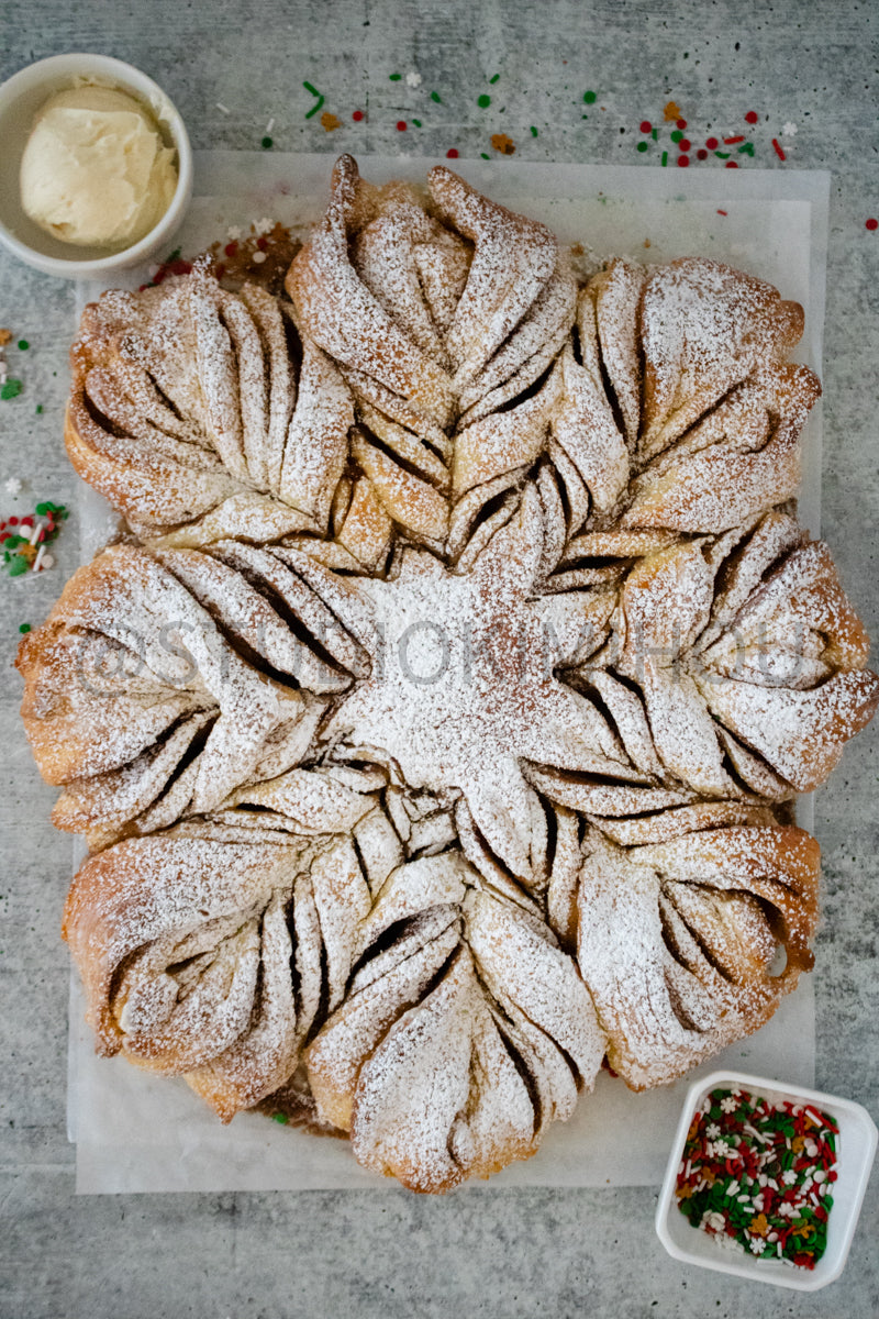 Semi-Exclusive Cinnamon Roll Snowflake on Concrete