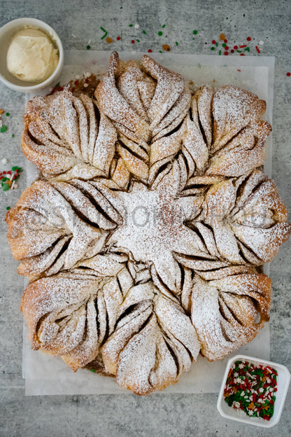 Semi-Exclusive Cinnamon Roll Snowflake on Concrete