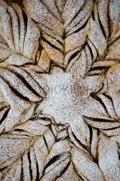 Semi-Exclusive Cinnamon Roll Snowflake on Concrete