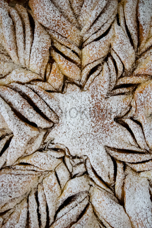 Semi-Exclusive Cinnamon Roll Snowflake on Concrete