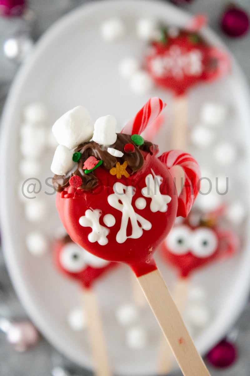 Semi-Exclusive Hot Cocoa Oreo Pop on Concrete